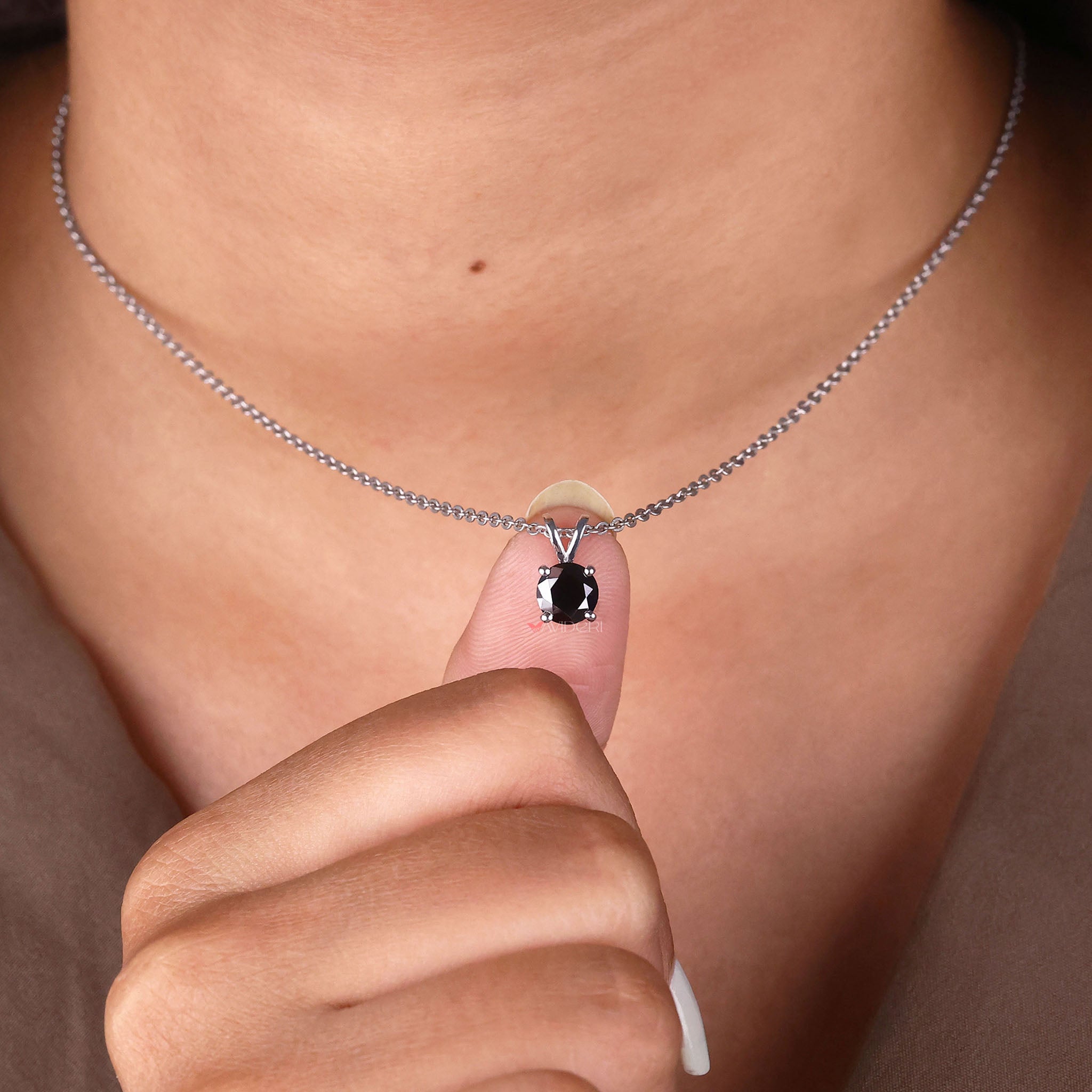 Moissanite pendant featuring a round cut pendant for classic beauty.