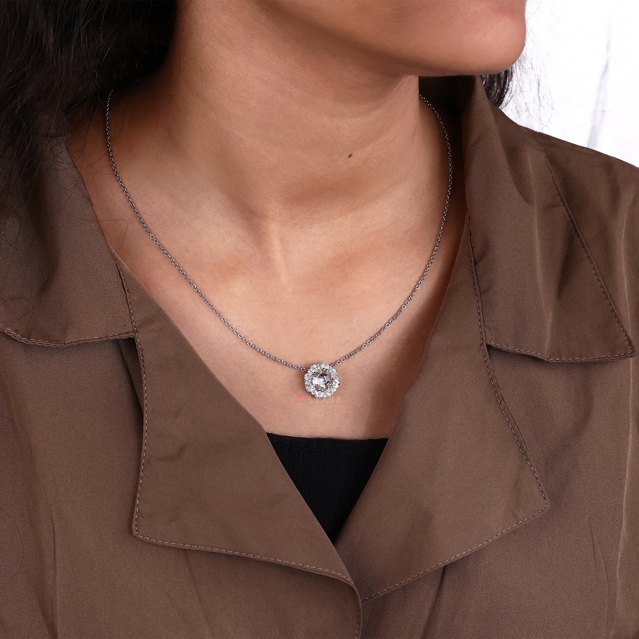 Marquise cut halo pendant with strong prong setting support.