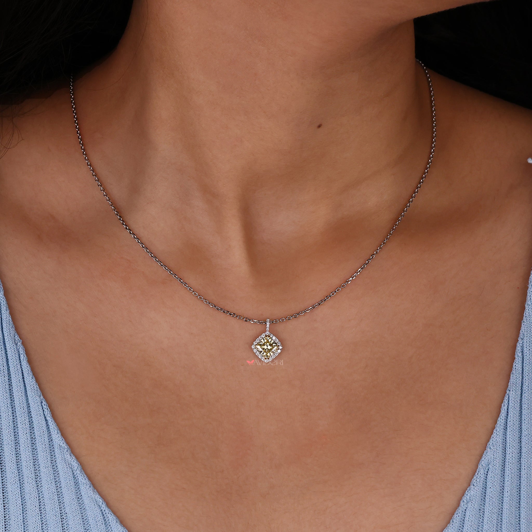Two-tone pendant combining yellow and white gold for a unique look.