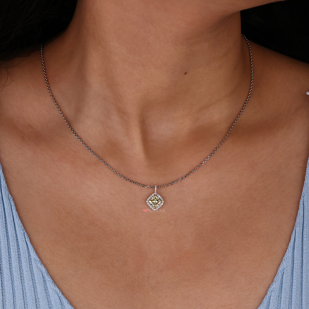 Two-tone pendant combining yellow and white gold for a unique look.