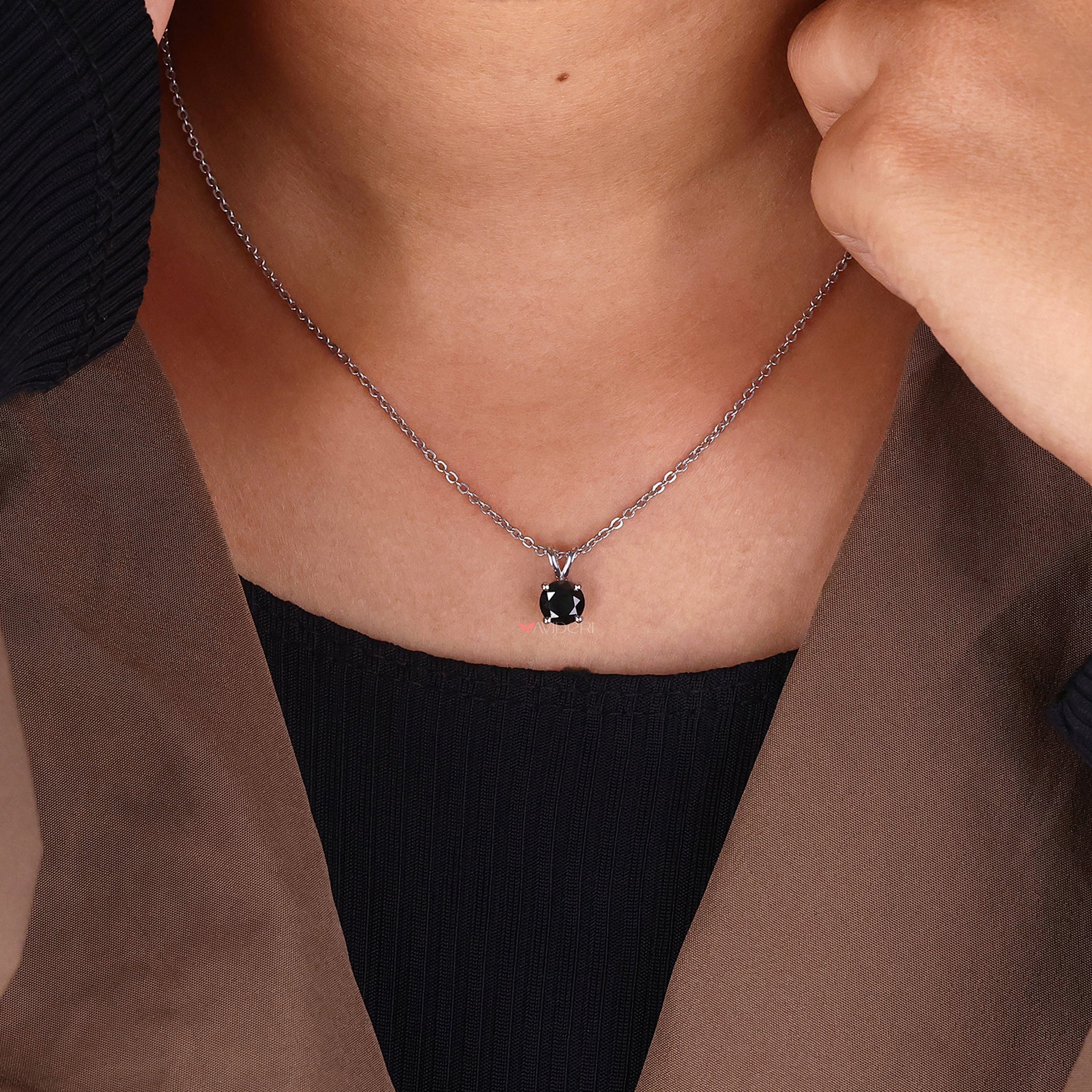 Moissanite pendant necklace with a round cut pendant for a sparkling finish.