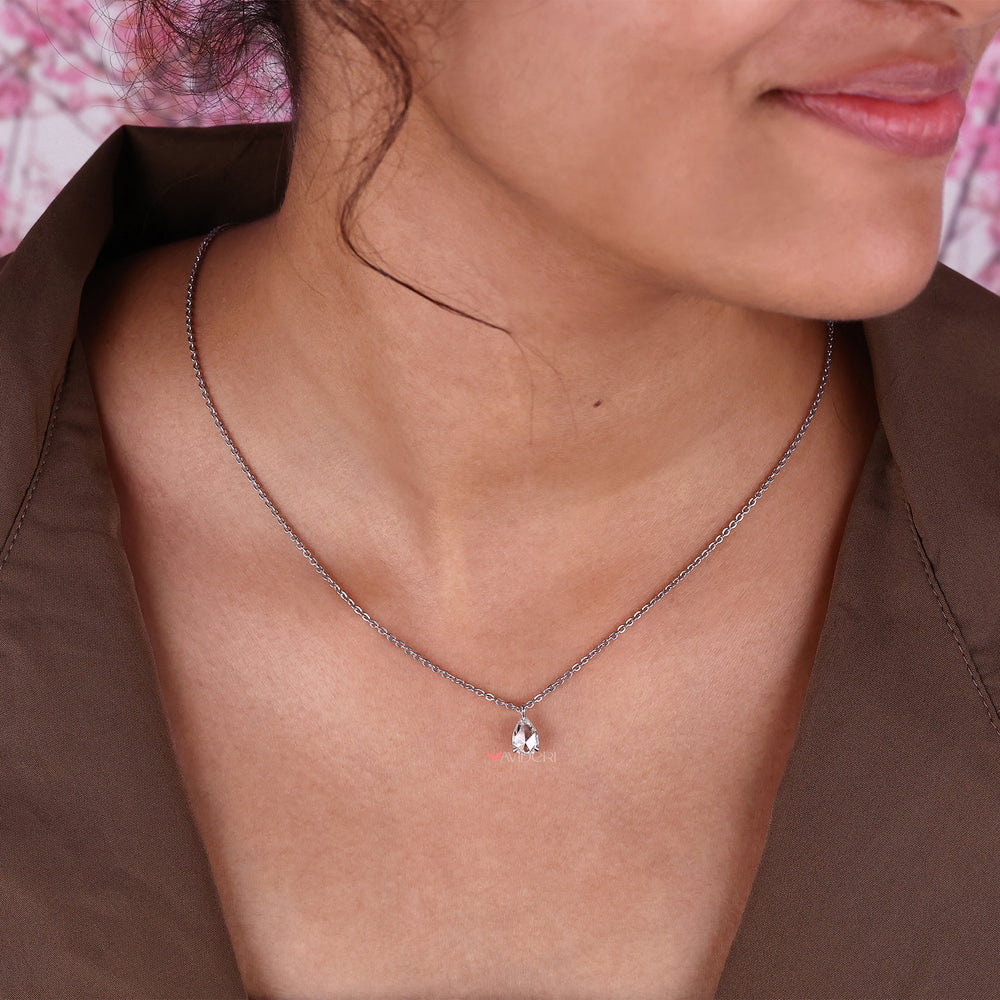 Pear solitaire pendant with a dazzling center stone, a timeless piece for any jewelry box.
