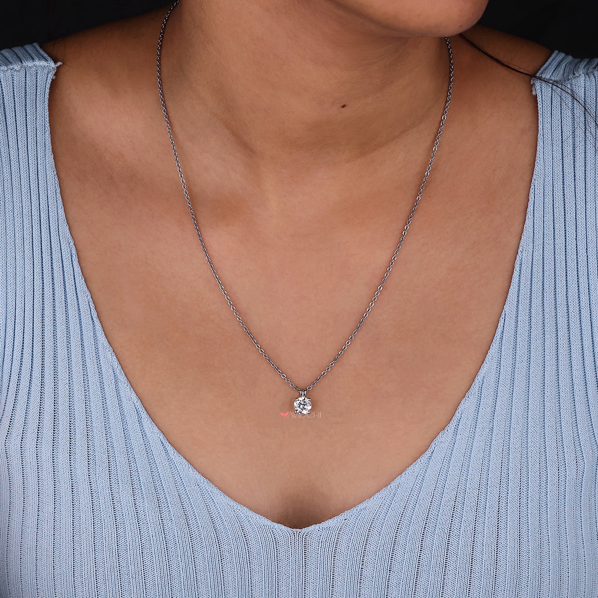 Dainty round cut solitaire pendant in prong setting for a clean, modern look
