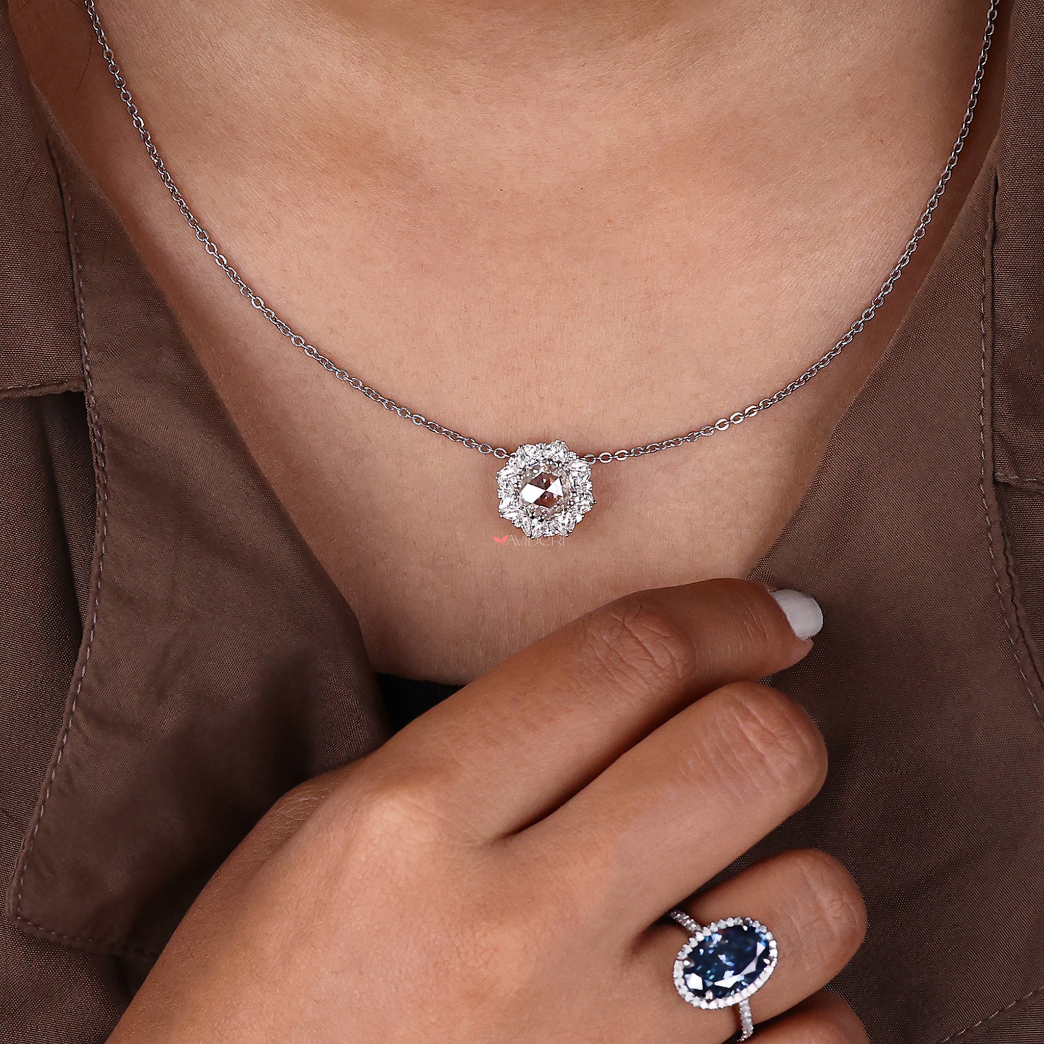 Round cut halo pendant set in white gold for daily wear.