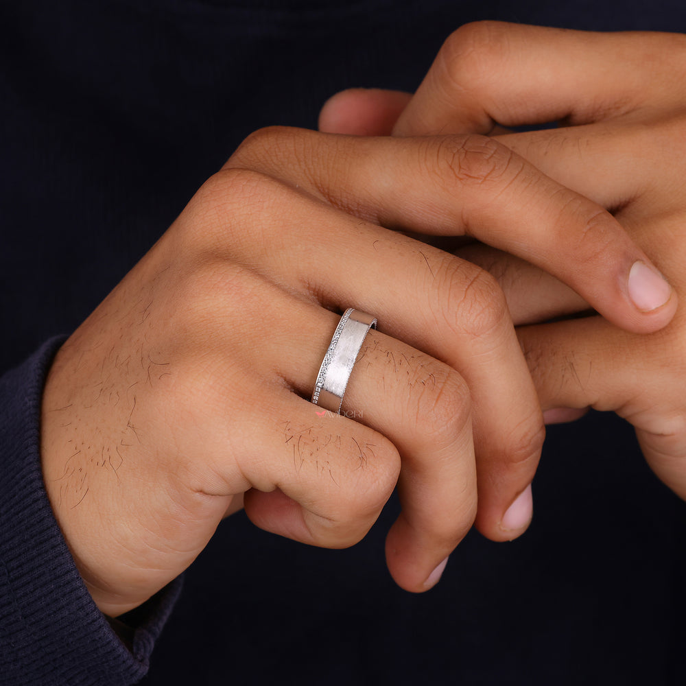Round diamond wedding ring delivers classic style with sparkling detail.
