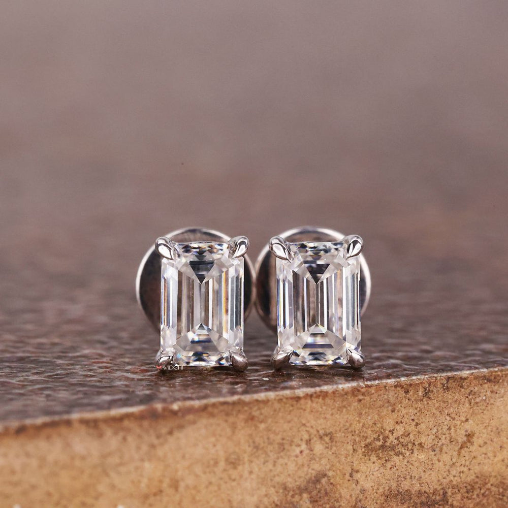 The claw prong earrings securely hold the gemstone with style.