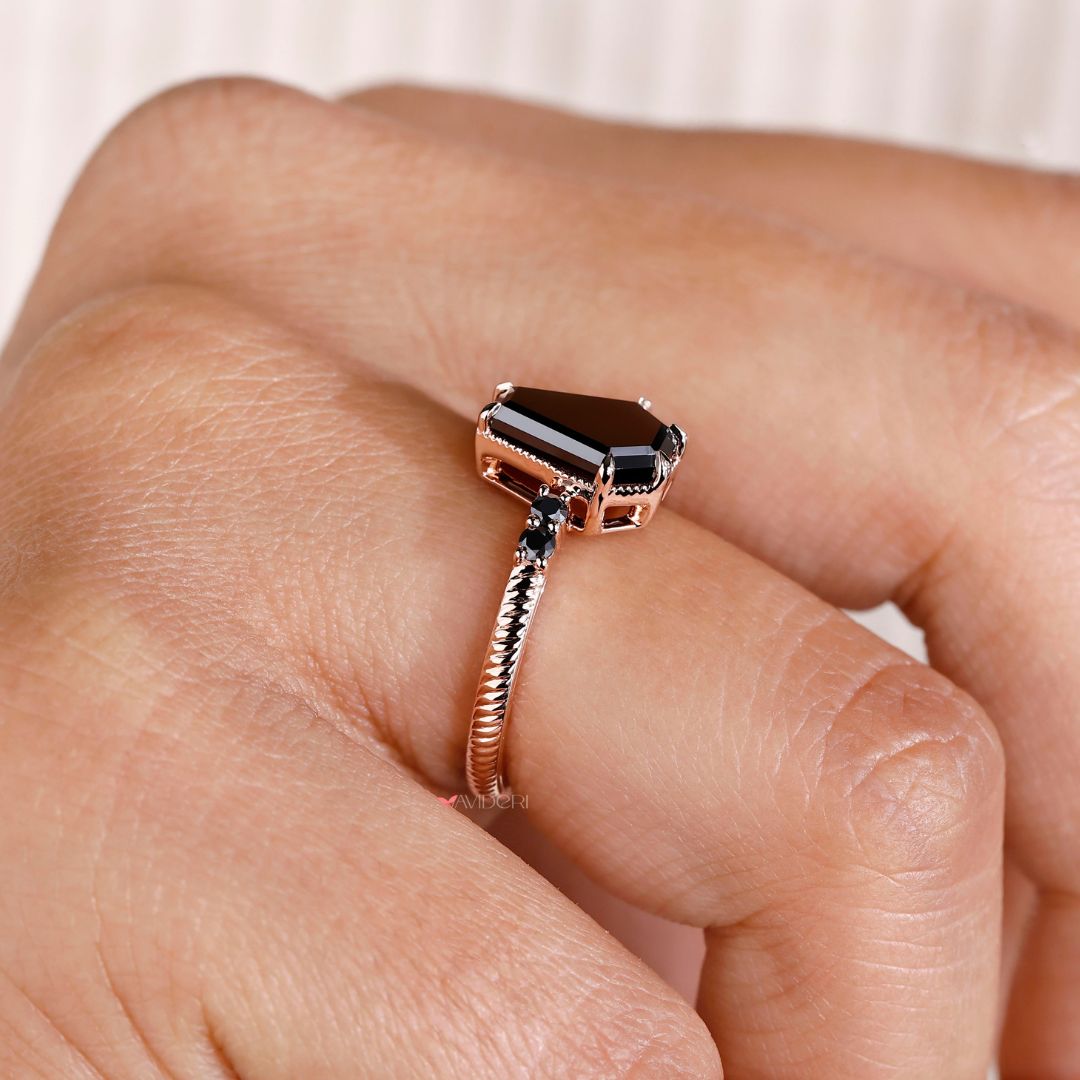 Avideri engagement ring featuring a unique coffin ring design with a round cut stone.
