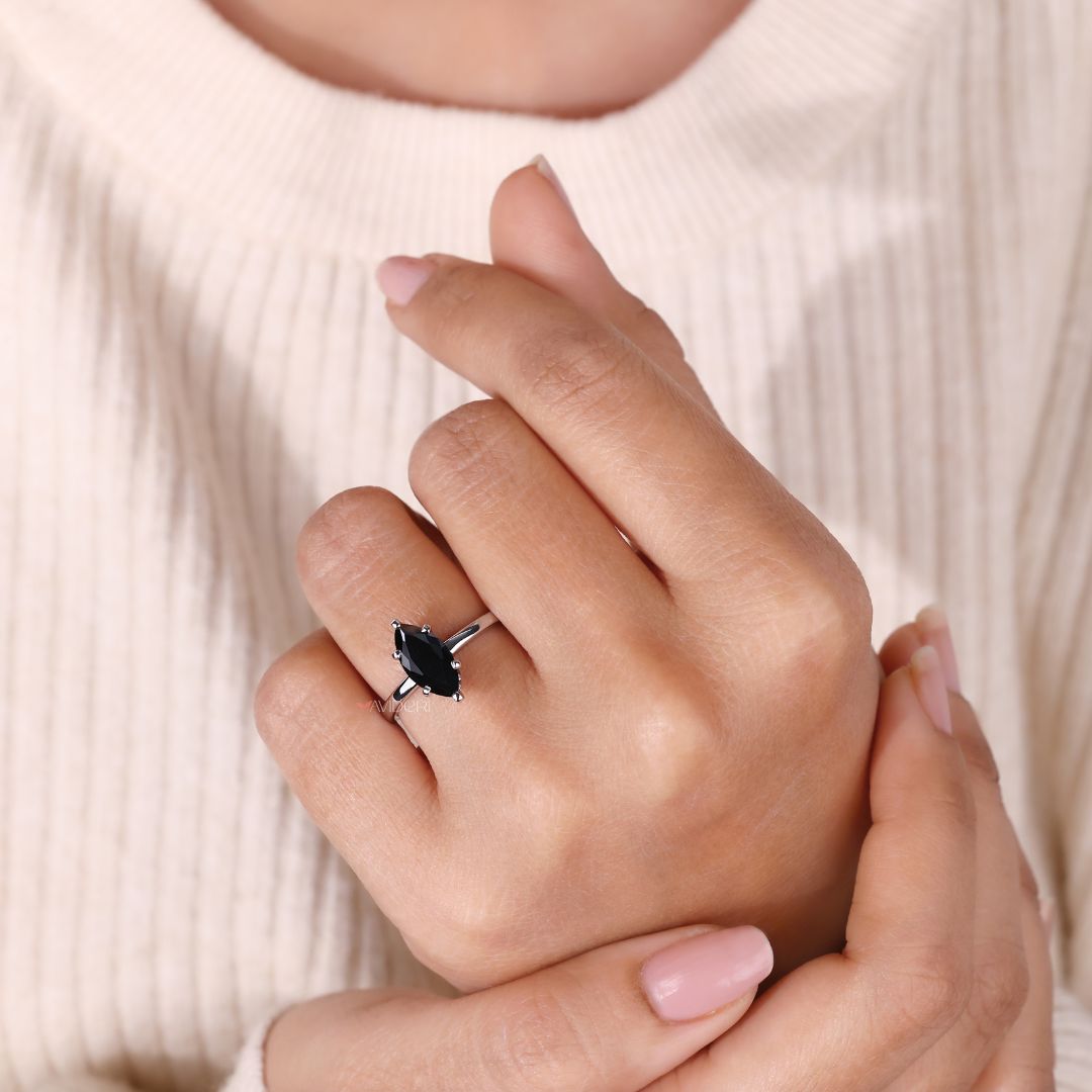 Unique moissanite engagement ring with a marquise cut for elegant sparkle.

