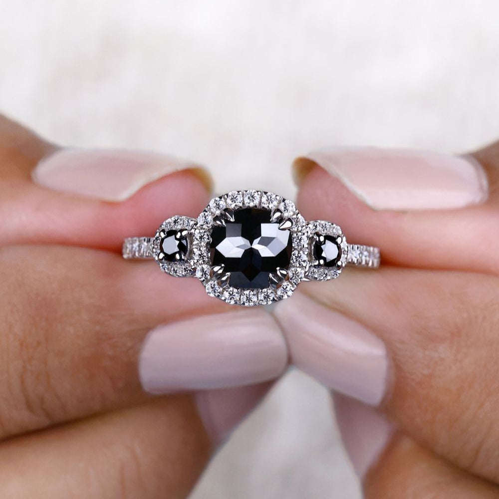 Cushion cut moissanite engagement ring featuring a stunning white gold setting.
