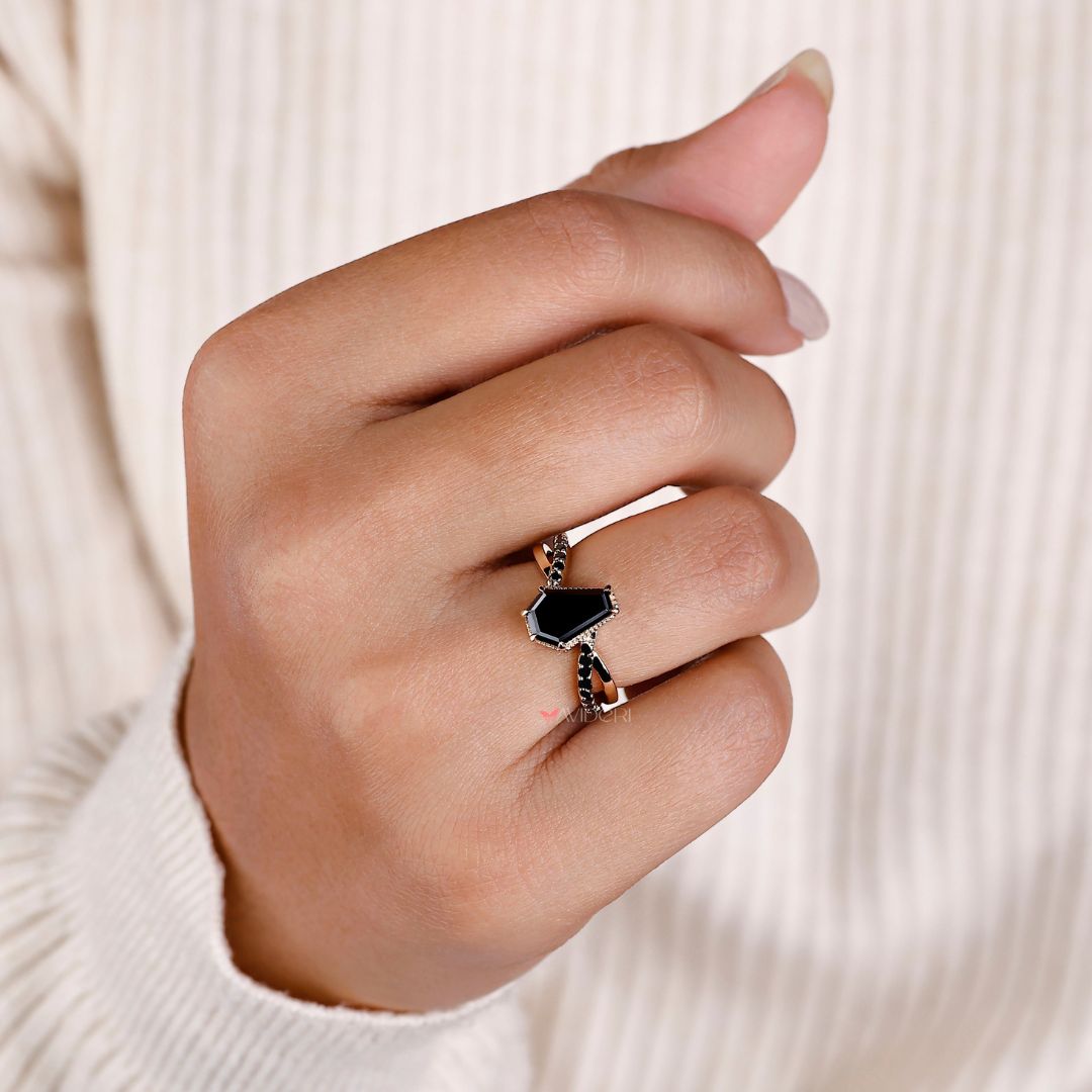 Black moissanite ring set in a sleek and modern black band.
