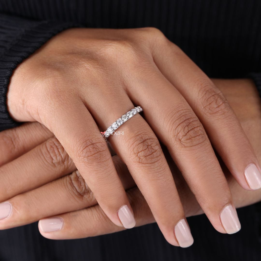 Moissanite wedding band shines brightly with eco-conscious elegance.
