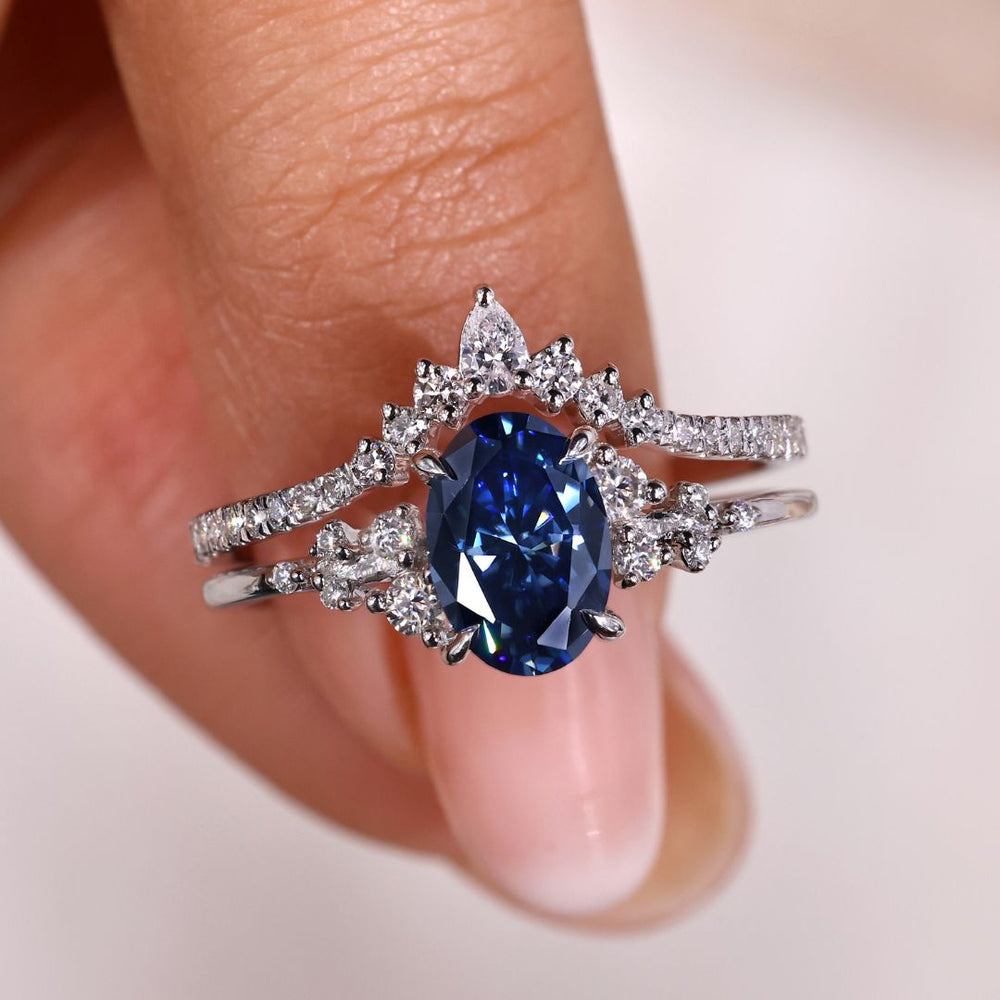 Oval engagement ring with wedding band, perfect for timeless elegance.