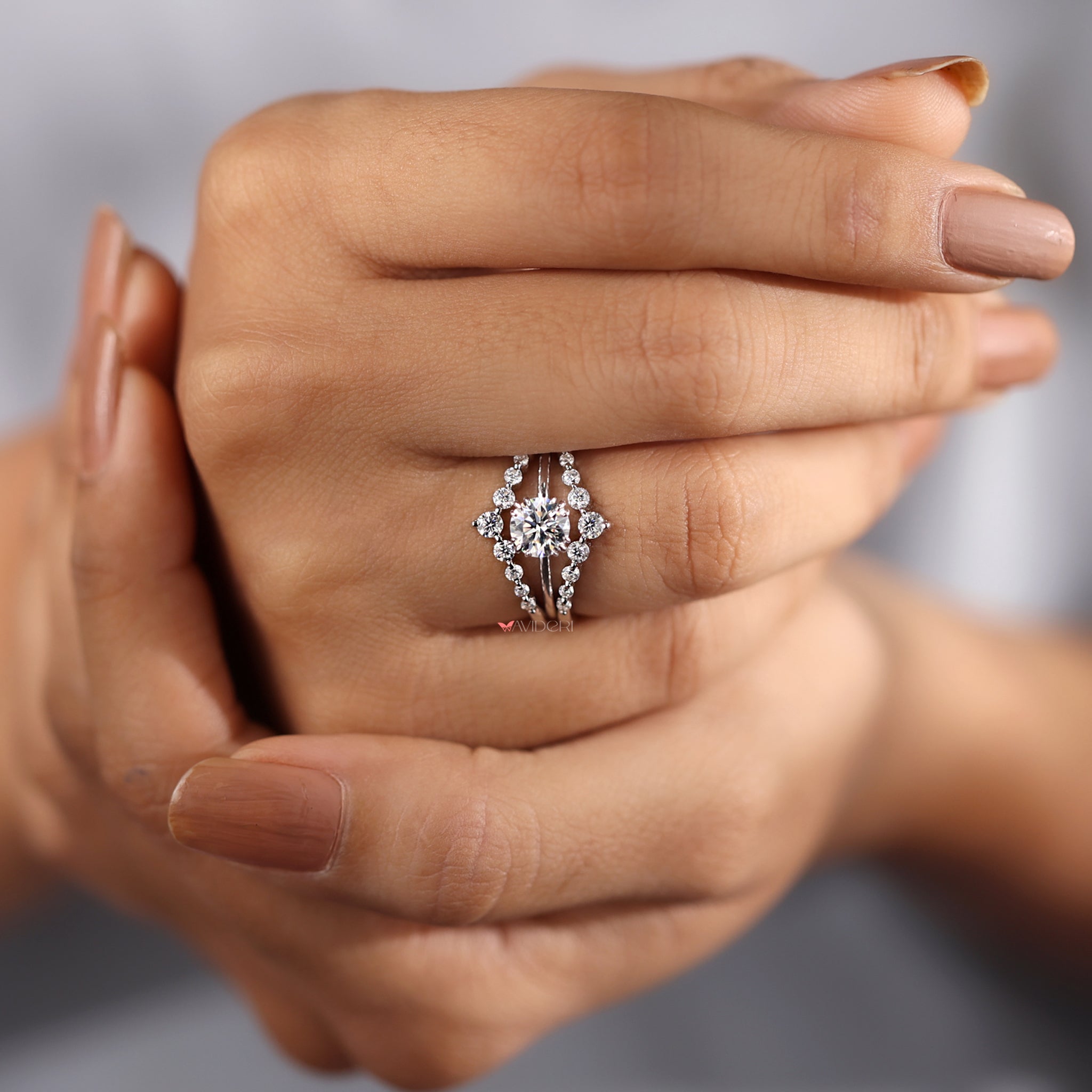 Double row pave band adding brilliance to the round cut ring.
