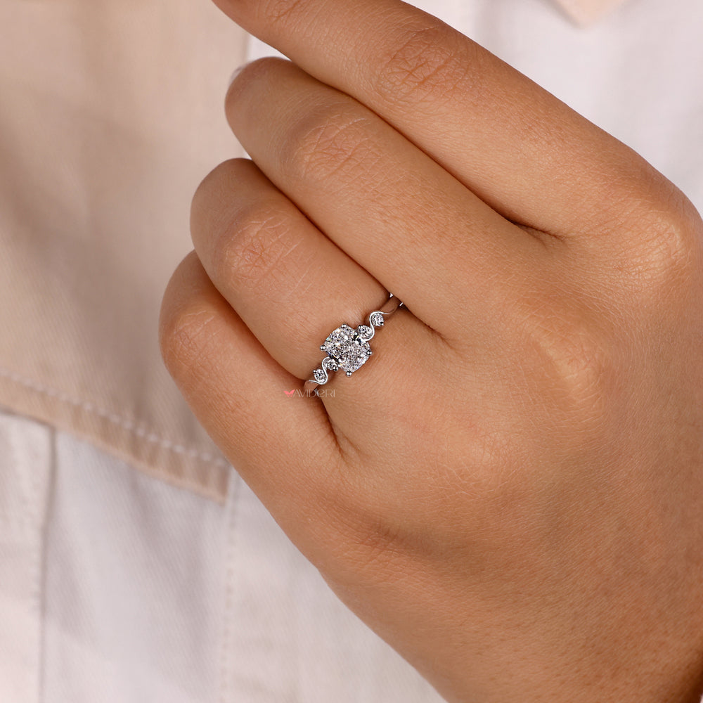 Prong setting ring with a round diamond engagement ring.
