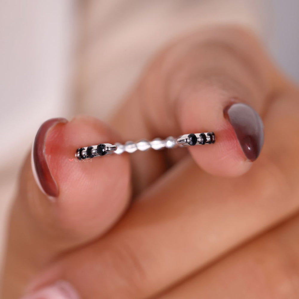 This round wedding band offers a timeless, symmetrical look.