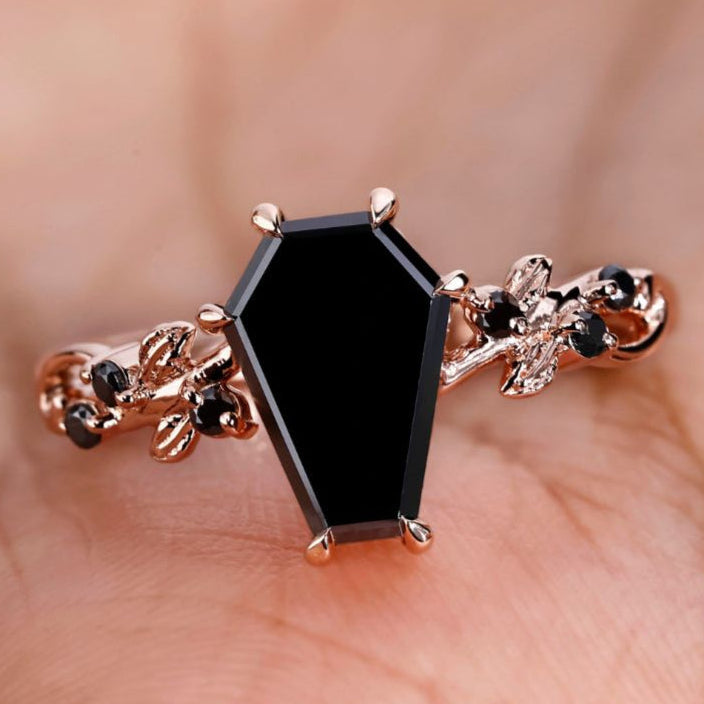 Coffin engagement ring with a unique and timeless design.
