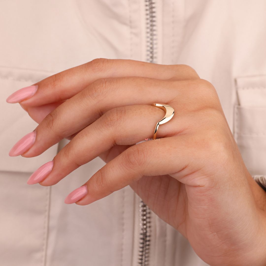 Yellow gold ring showcasing a sleek, minimalist design
