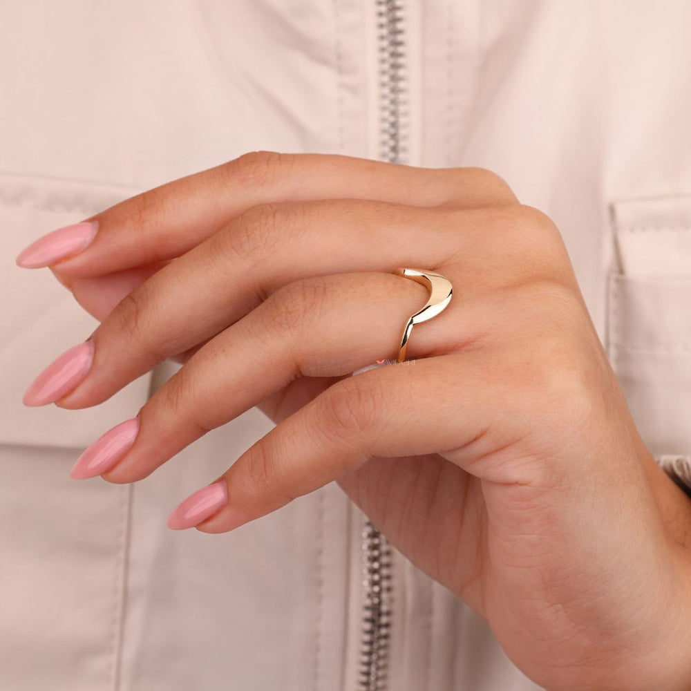 Yellow gold ring showcasing a sleek, minimalist design
