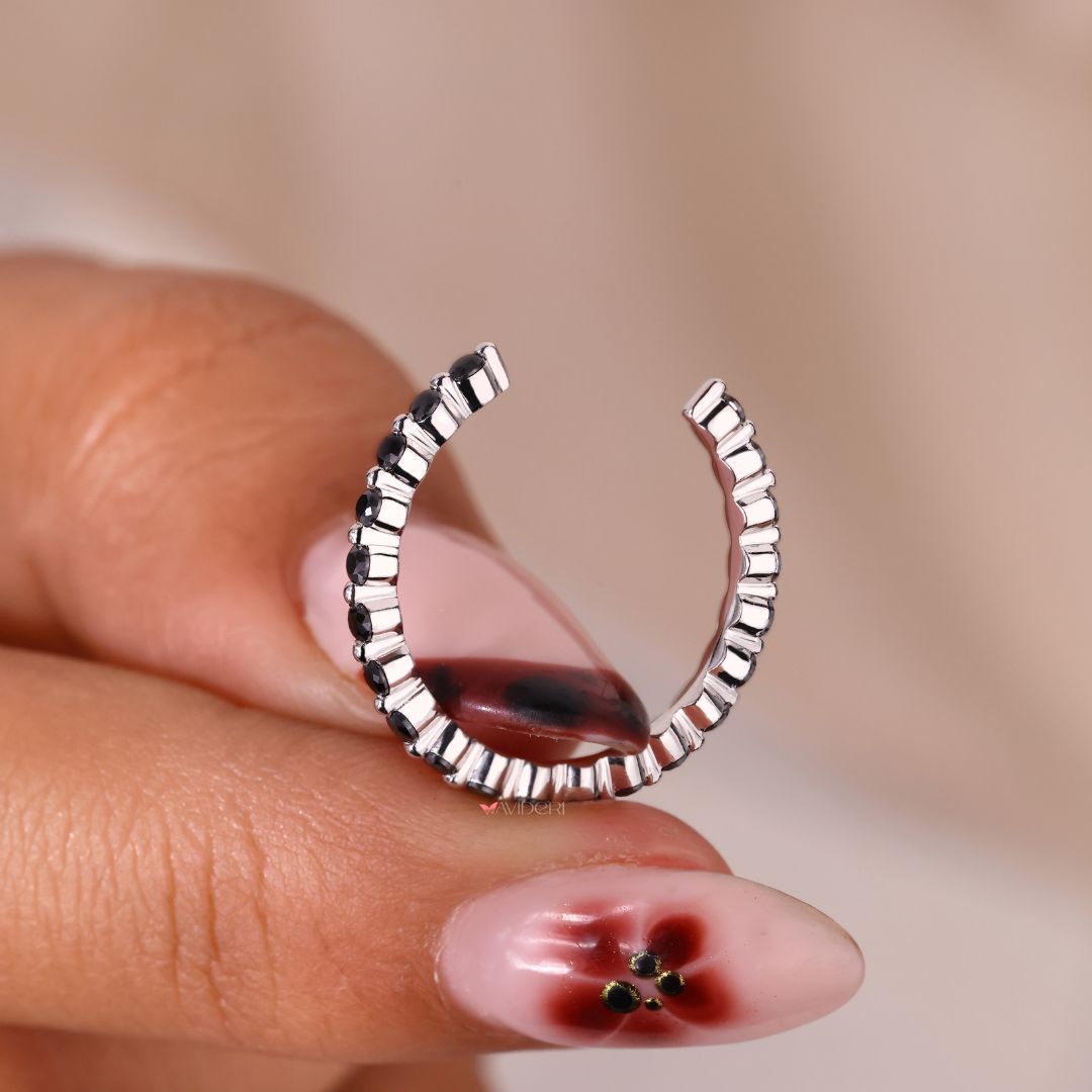 The white gold wedding band complements any gemstone with elegance.