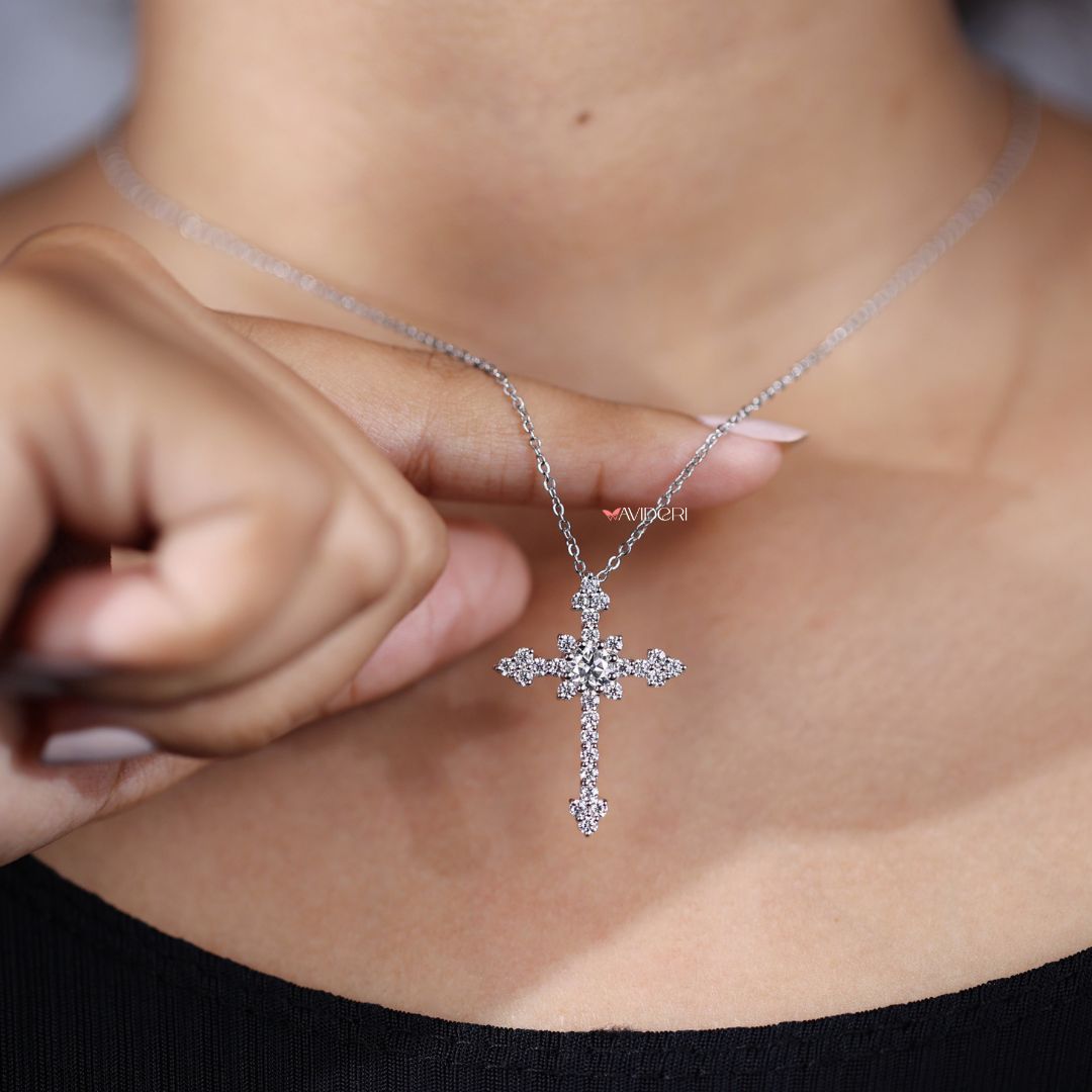 White gold cross pendant offers bright style and spiritual meaning.