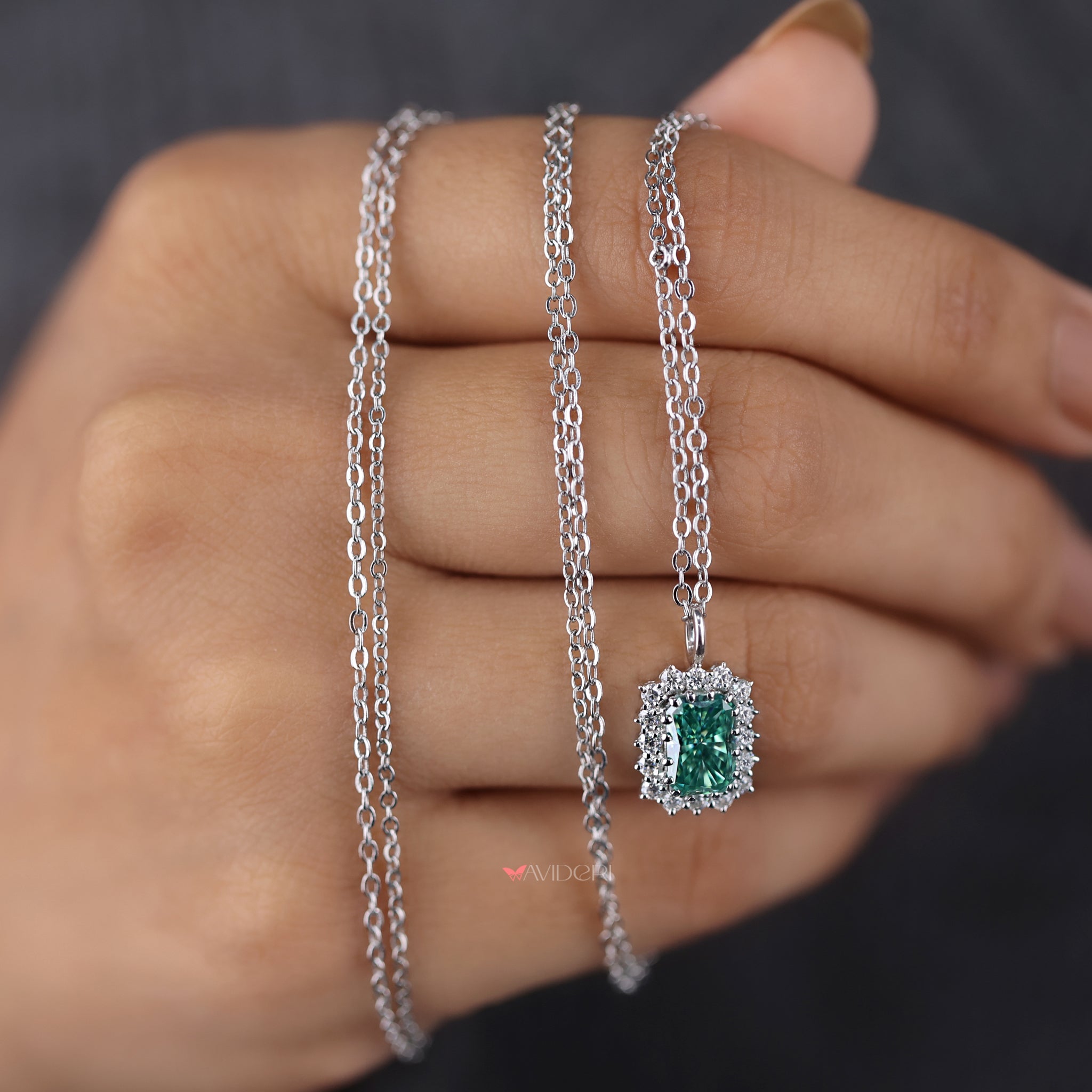 Cyan Blue Radiant moissanite pendant showcases a vivid gemstone that stands out.