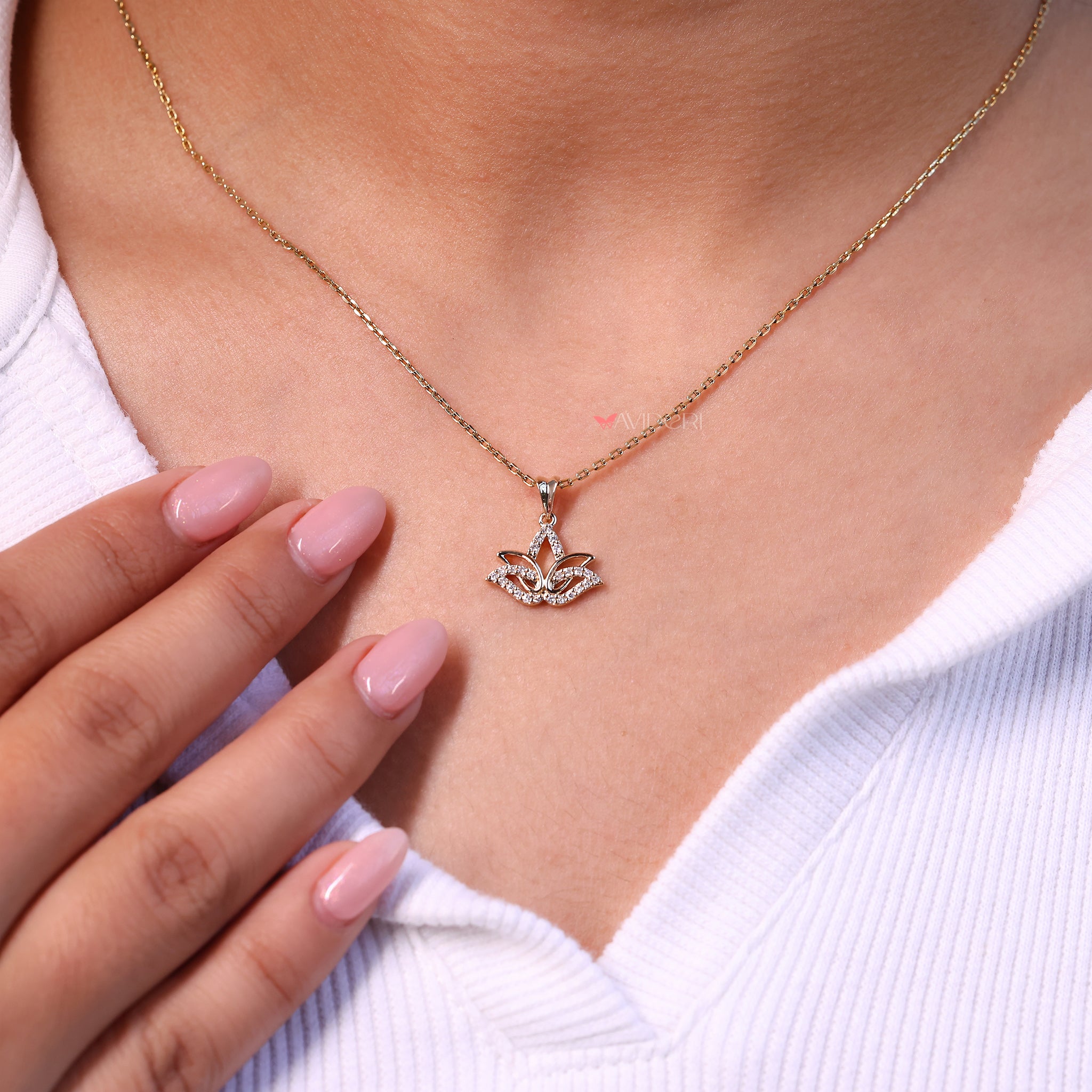 The gold lotus pendant adds a touch of warmth and style.