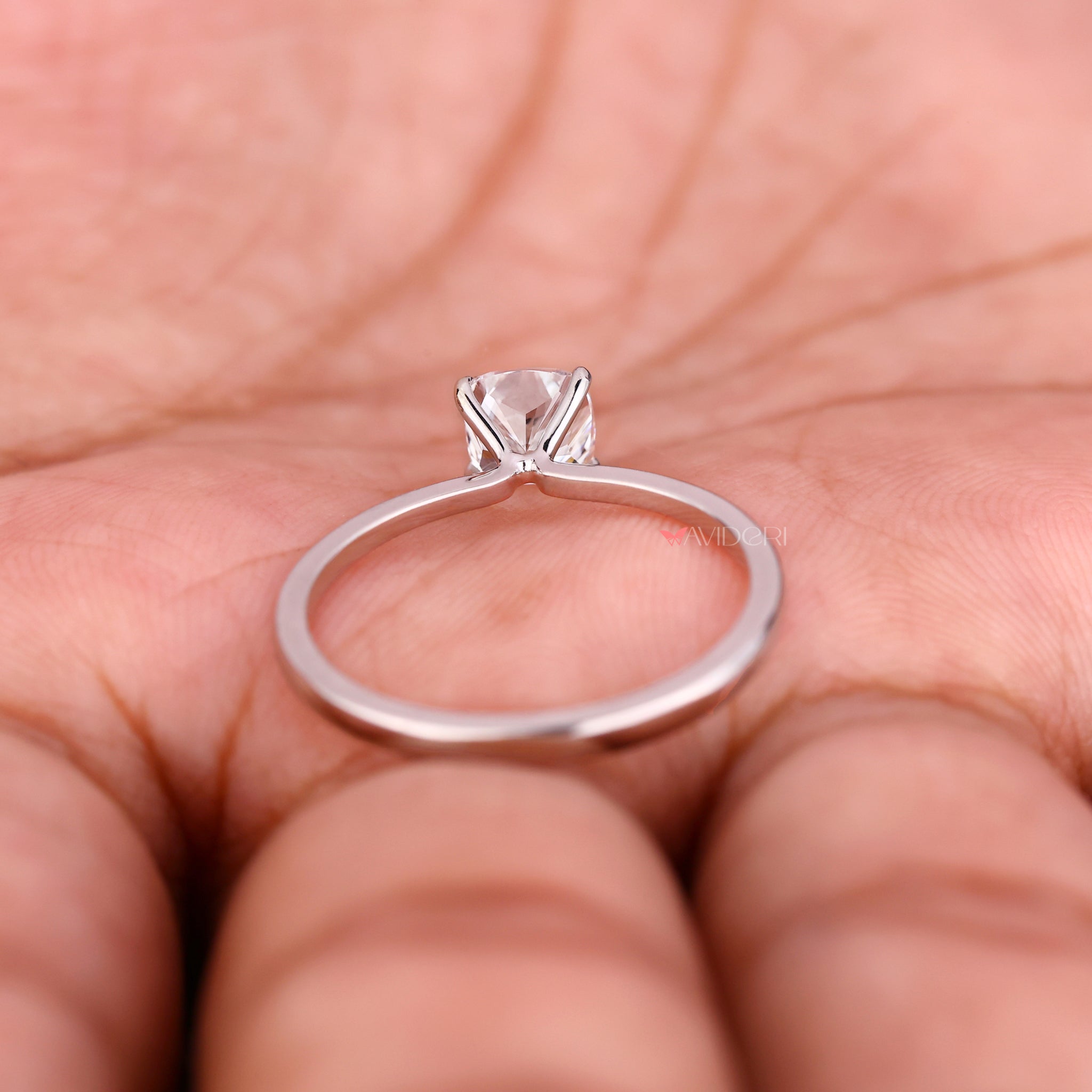 Handmade ring with cushion diamond ring showcasing claw prong setting and modern elegance.
