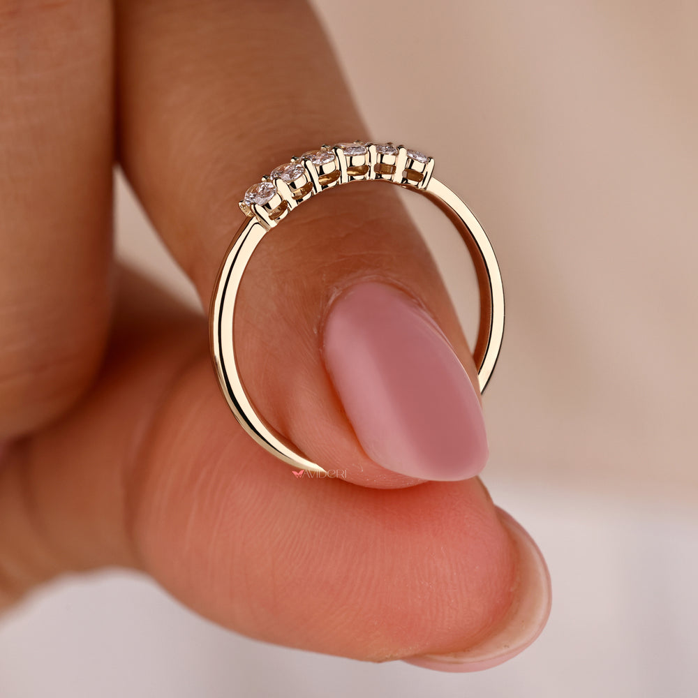 Yellow gold eternity band with diamonds all around.
