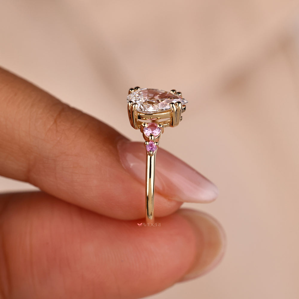 Pink sapphire ring with a vibrant gemstone that exudes romance and charm.
