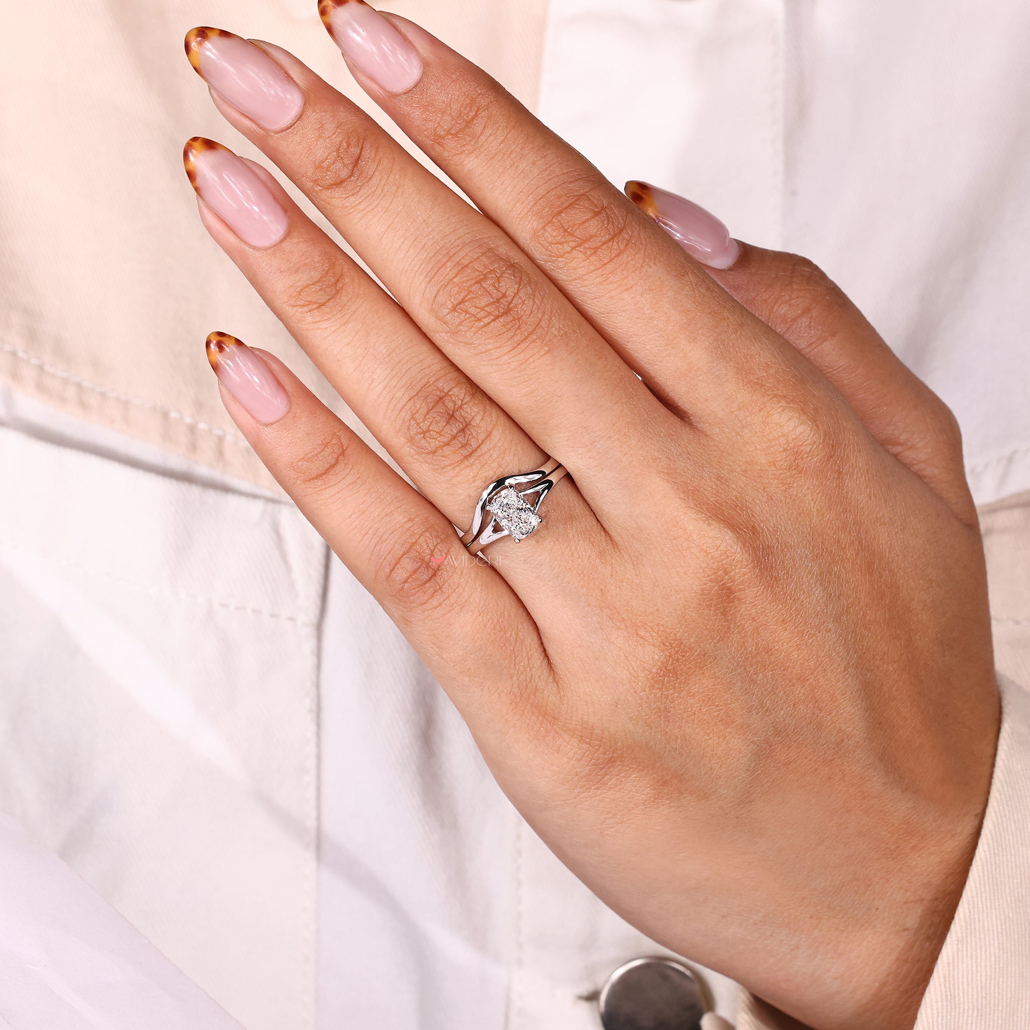Solitaire ring and band set featuring a cushion cut diamond.