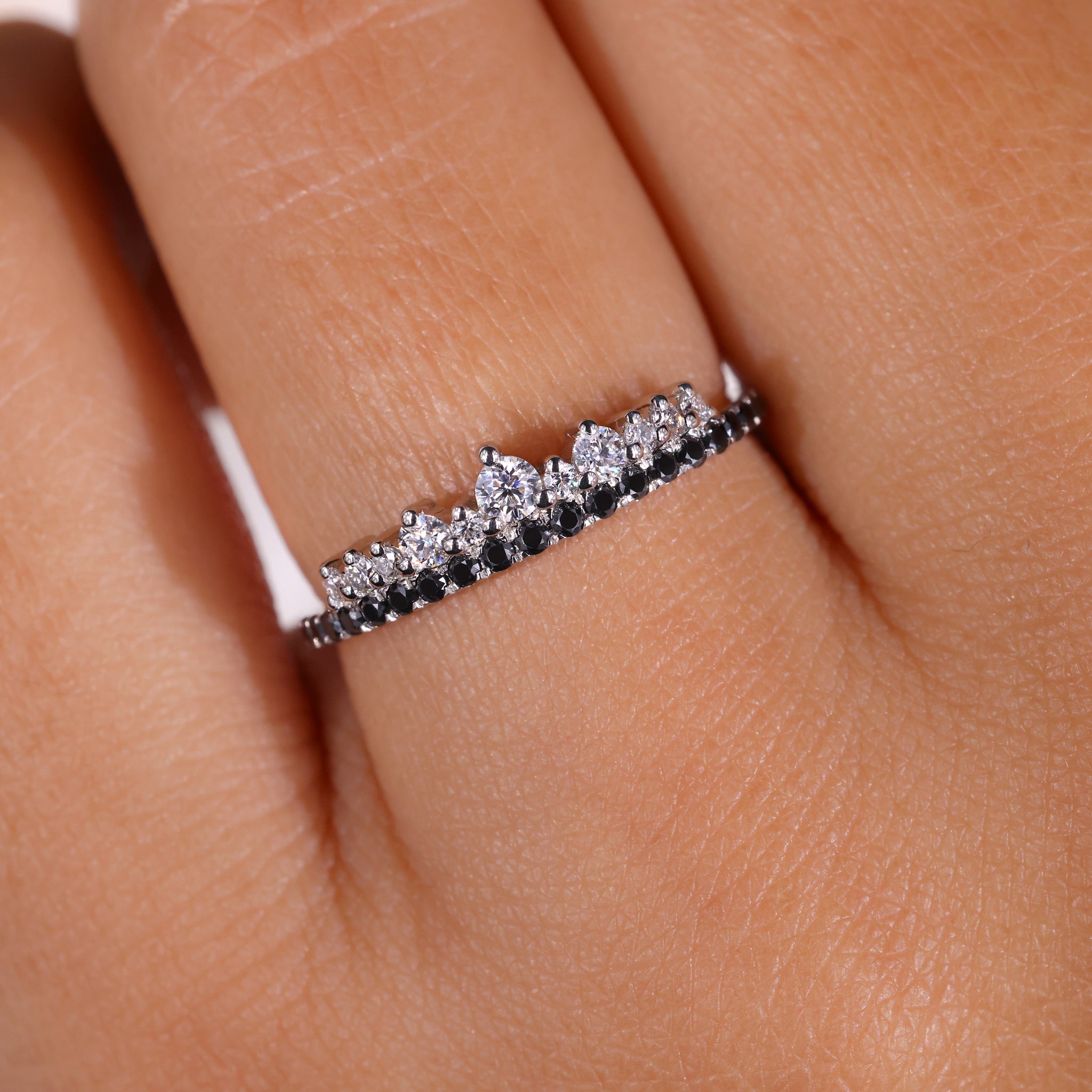White gold wedding band featuring a round cut eternity band design.