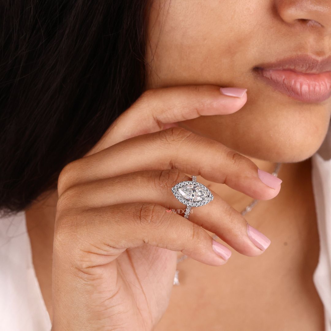 Moissanite engagement ring featuring a halo design
