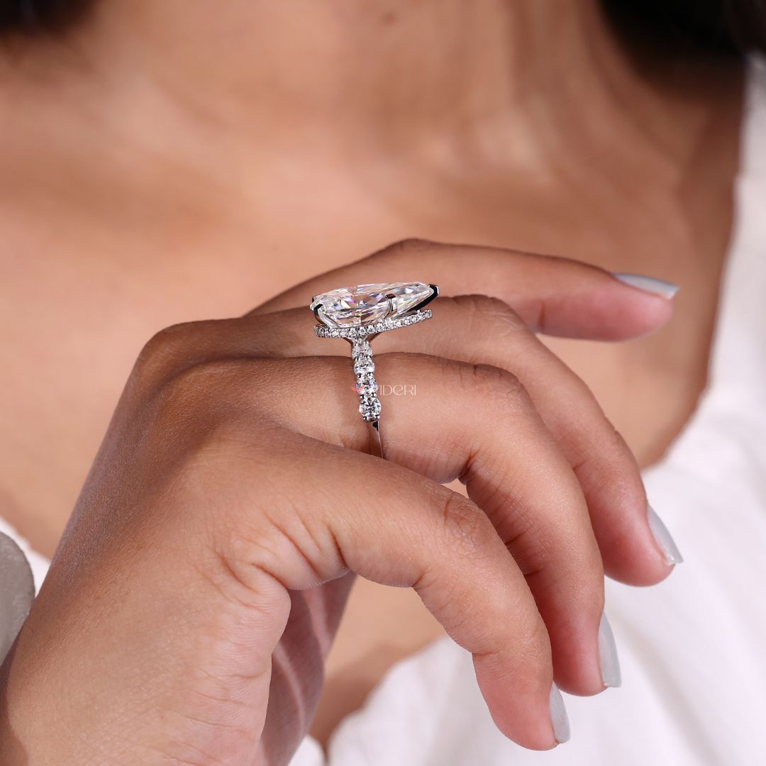 Pear-shaped engagement ring with a 5 prong setting.

