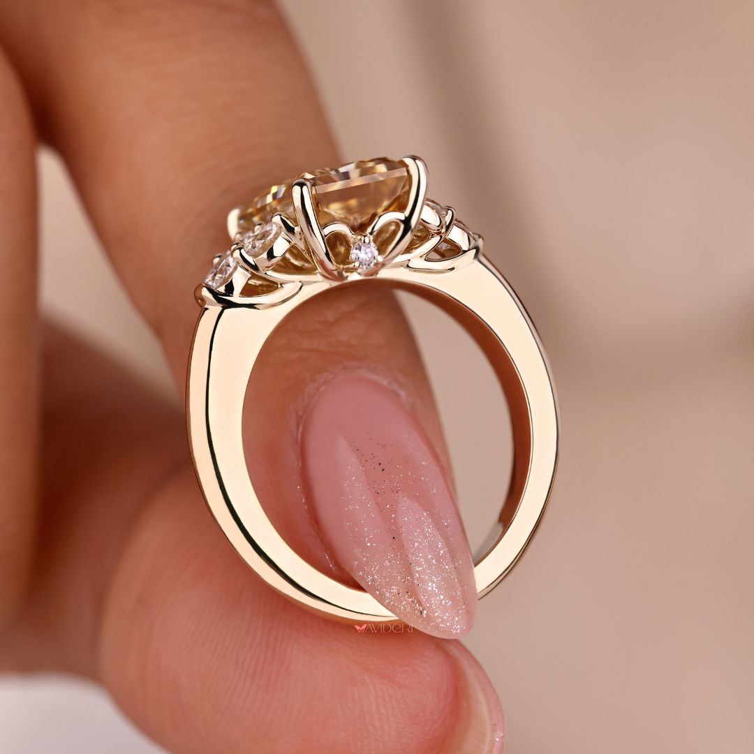 Champagne Color Moissanite Ring placed on a gold band.
