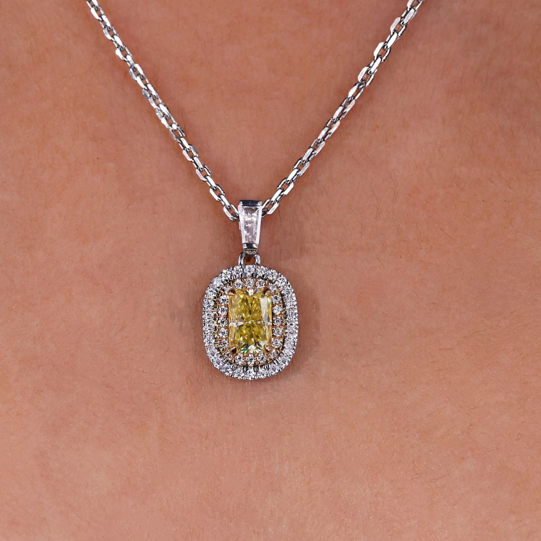 Double halo pendant necklace with radiant cut center stone.