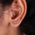These crawler stud earrings sit perfectly along the earlobe, adding a modern and stylish edge to your look.