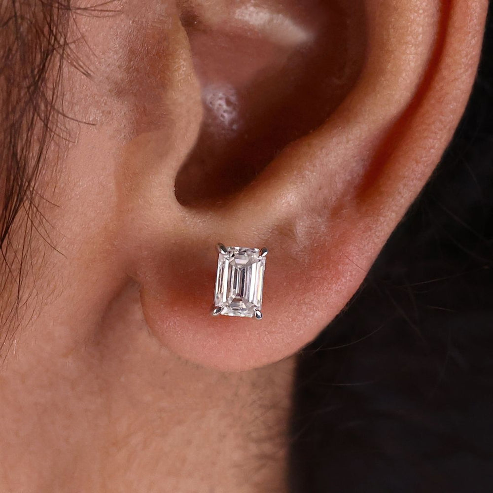 These emerald stud earrings offer a classic, elegant design.