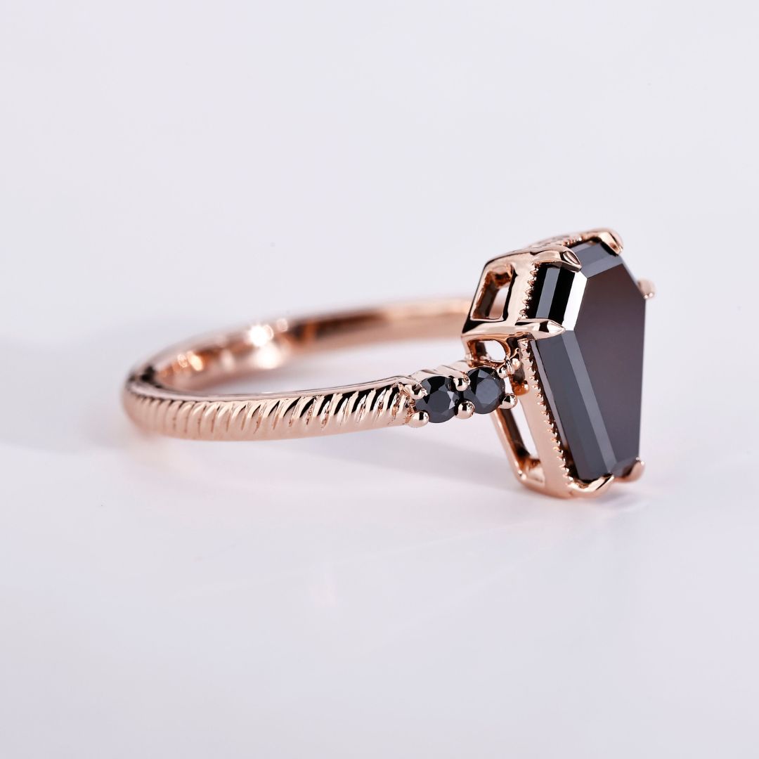 Coffin engagement ring with a stunning round cut ring design.
