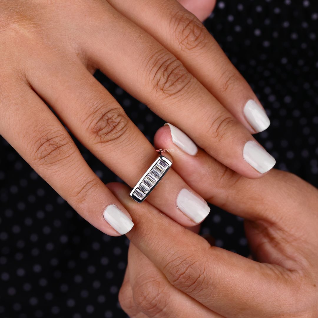 7 Stone wedding band creates a meaningful design with evenly spaced moissanite stones.
