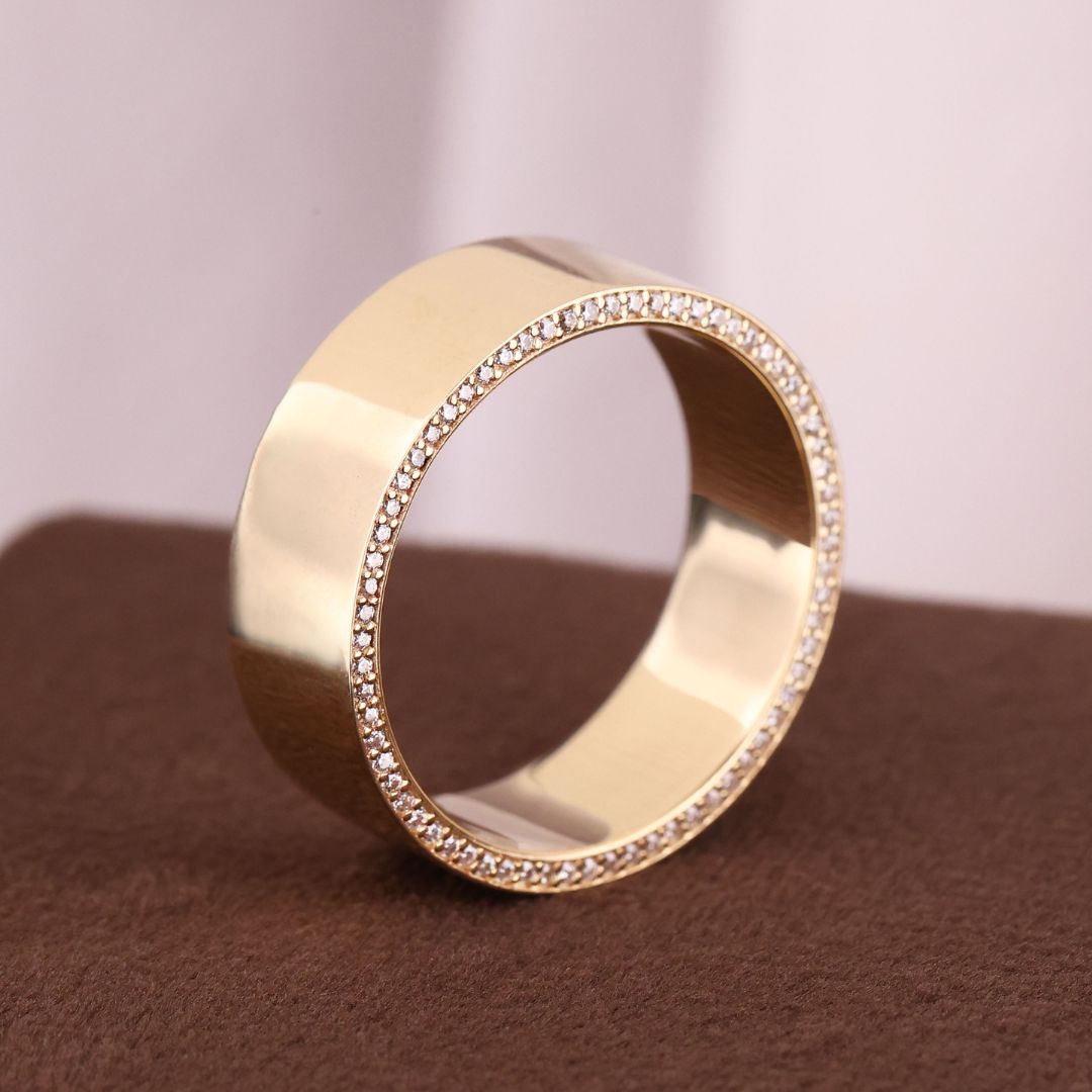 Wider Band Men's Moissanite Eternity Wedding Band with round cut moissanite stones.

