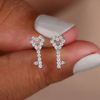 Round Cut Moissanite Earrings In Key Shape Design