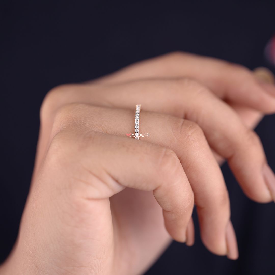 Half eternity wedding band offers subtle brilliance and everyday comfort.
