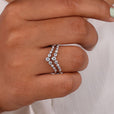 Chevron wedding band features a unique V-shaped design for a bold, modern look.
