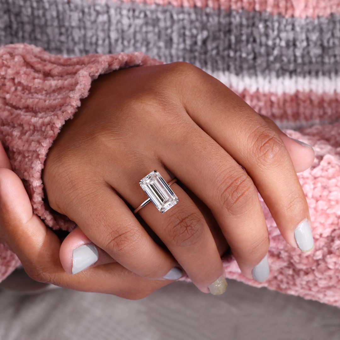 Avideri ring with a beautiful emerald cut moissanite stone.
