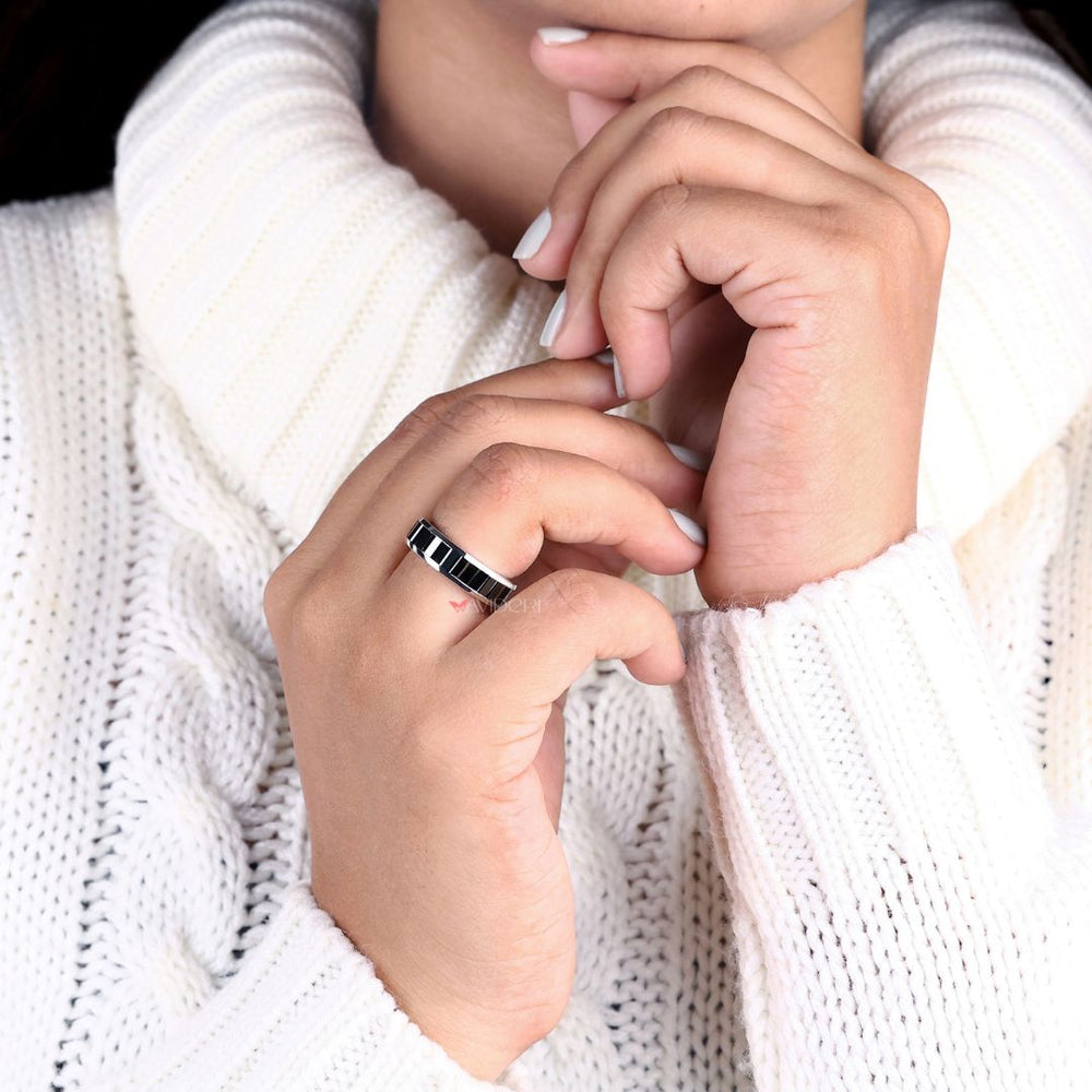 Sleek baguette band with diamonds set in a timeless design.
