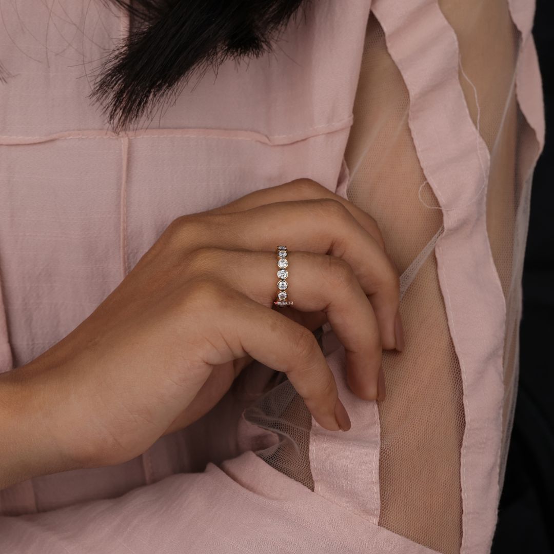 Simple gold band delivers minimal elegance with a smooth polished finish.
