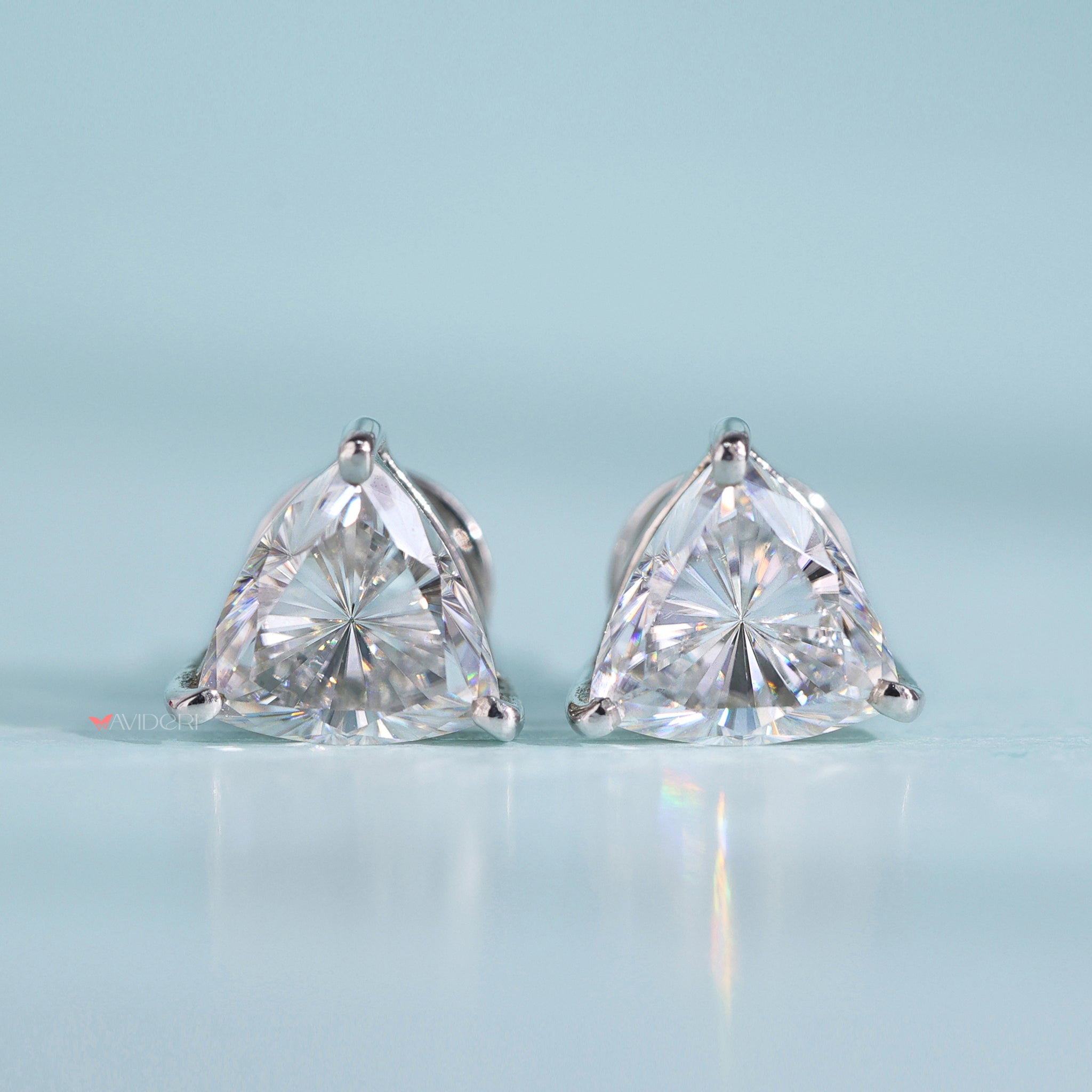 Three prong earrings offer a sleek and secure design.