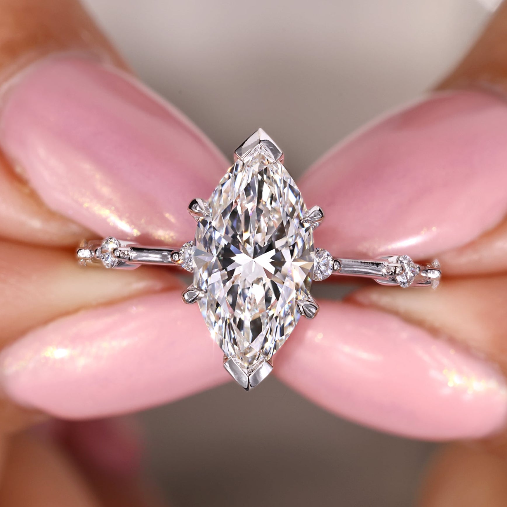 Marquise diamond ring featuring a sleek prong setting.