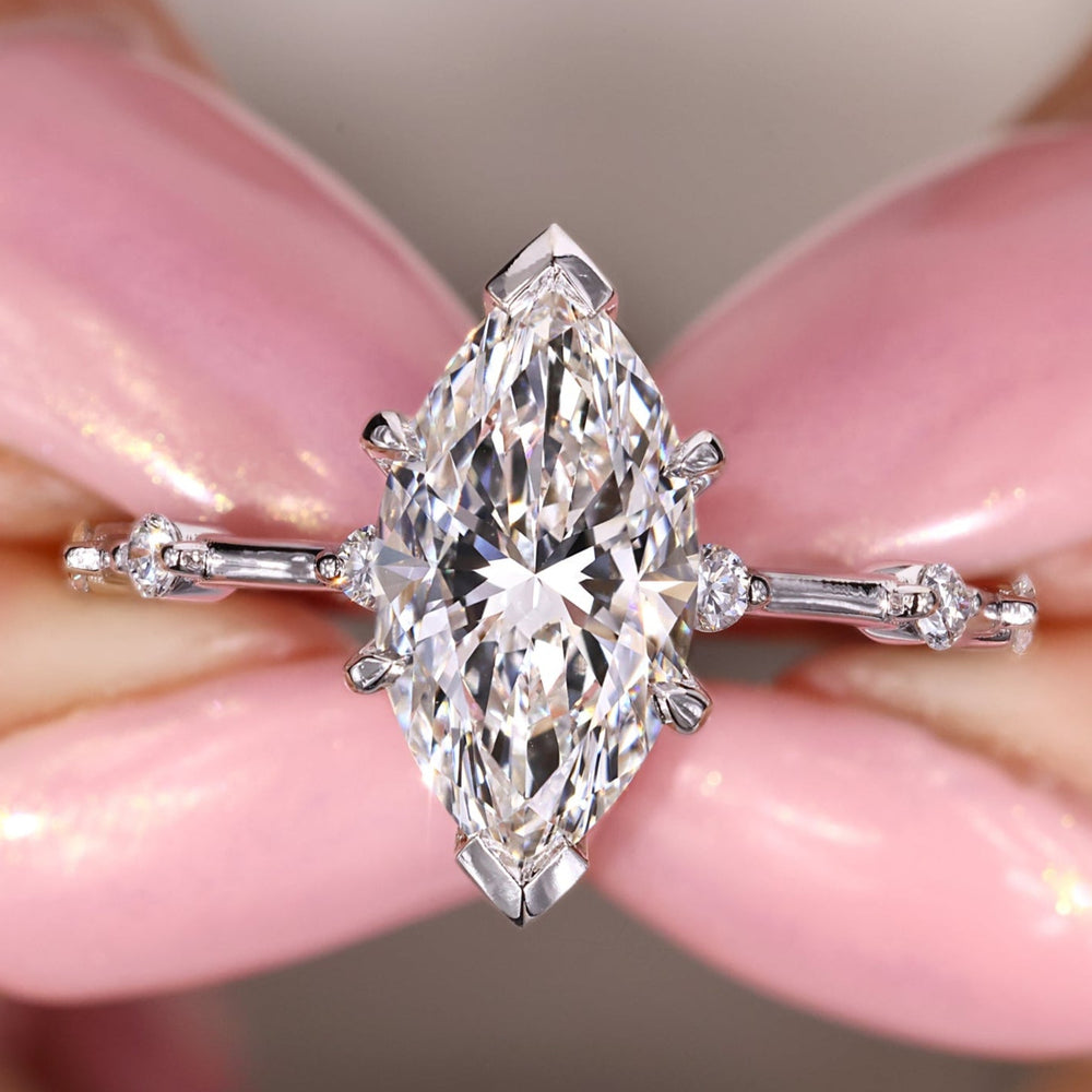 Marquise diamond ring featuring a sleek prong setting.