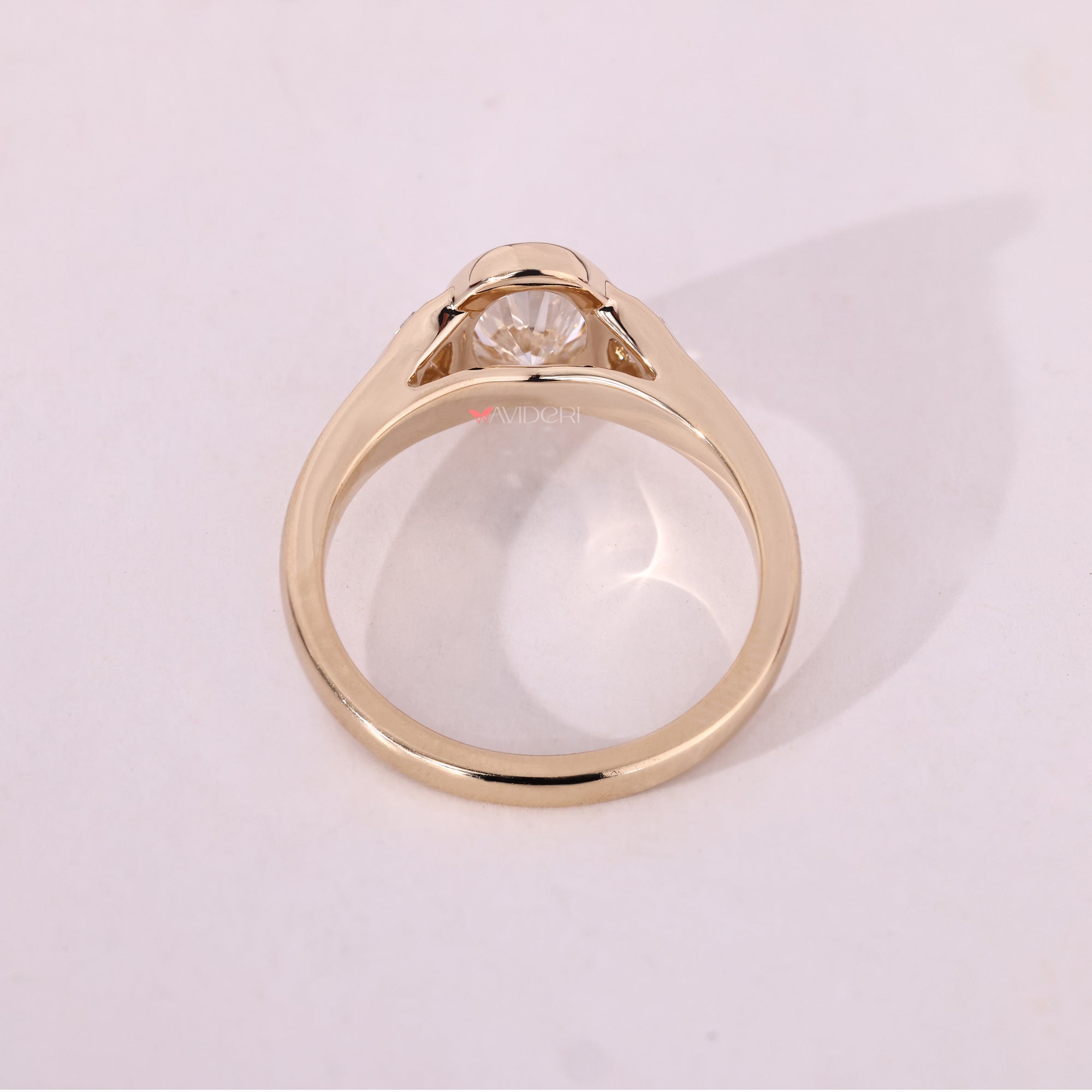 Yellow gold engagement ring with tapered shank.